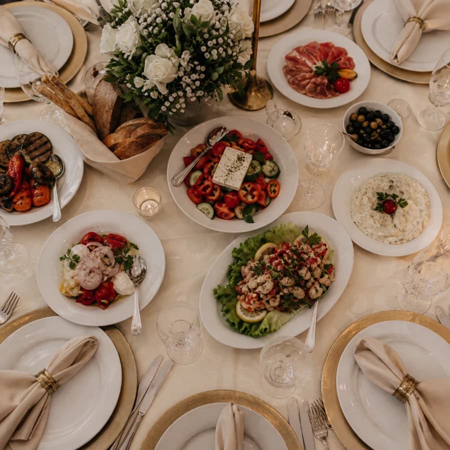 Formal Glamur banquet table with shared dishes and place settings