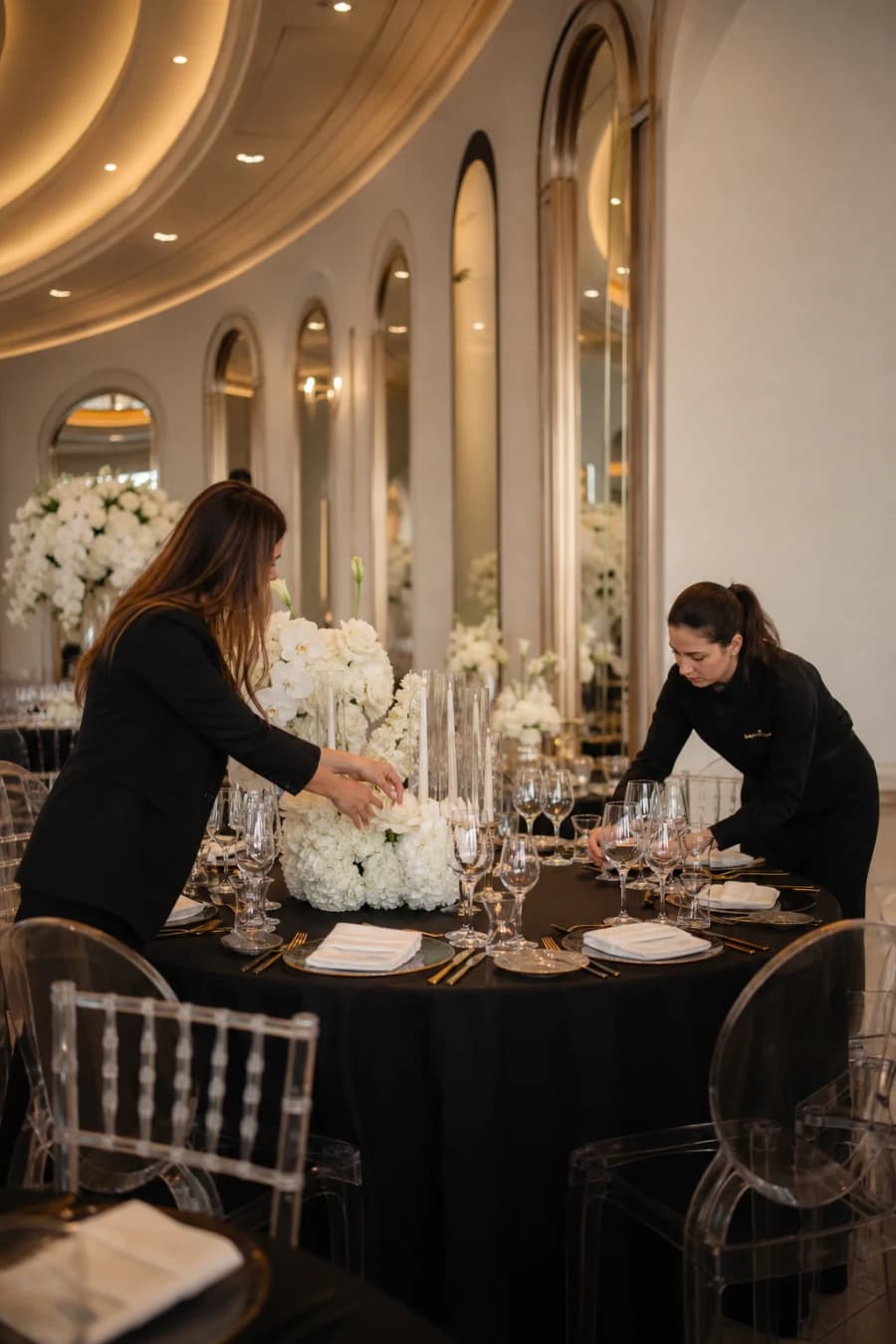 Glamur staff preparing flowers and table settings for a wedding